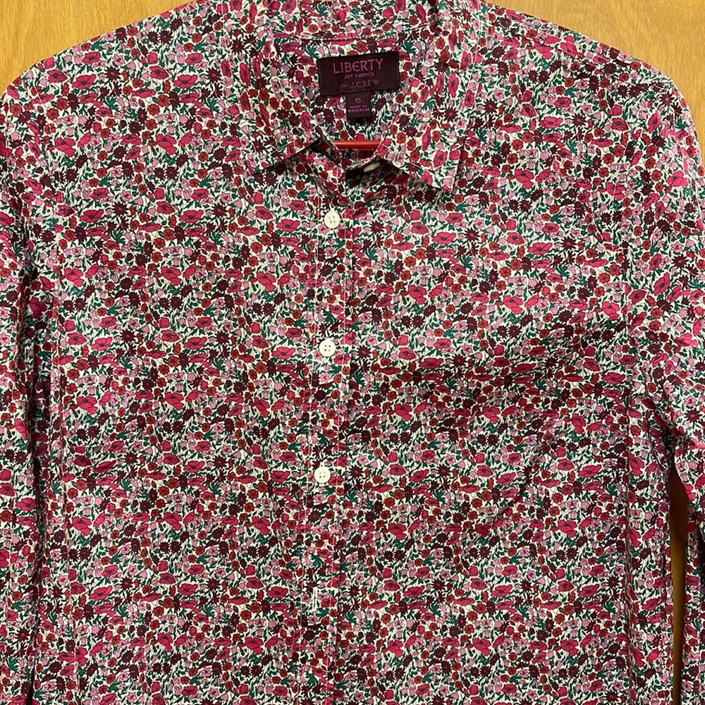 Womens floral blouse in shades of magenta, violet, cream and green